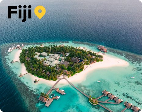 white sand beach, palm trees and crystal clear water in Fiji